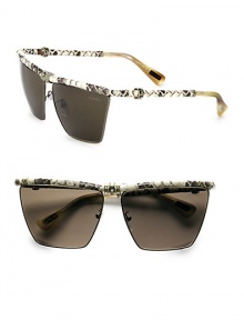 A modified square style in sleek metal accented in luxurious snakeskin-print leather and glittering Swarovski crystals. Available in silver/black with smoke gradient lens. Snakeskin-print leather temples and brow barSwarovski crystals100% UV protectionMade in Italy 