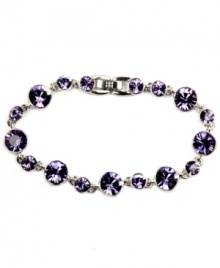 Customize your look with a flexible fit and glam glass accents. Regal, violet hues give purpose to Givenchy's stunning bracelet. Set in silver-plated mixed metal. Approximate length: 7-1/4 inches.