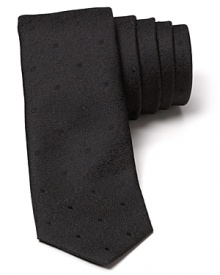 The slim, modern silhouette of this alluring tonal polka dot tie separates it from the old guard. Wrought in exceptional silk for a luxurious addition to your wardrobe, it pairs well with fine dress shirting and more casual looks alike.