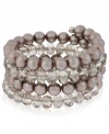 Wrap star. This coil bracelet from Kenneth Cole New York is crafted from silver-tone mixed metal with taupe glass pearls and cherry beads making a bold fashion statement. Item comes packaged in a signature Kenneth Cole New York Gift Box. Approximate length: 7-1/2 inches. Approximate width: 1-1/4 inches.