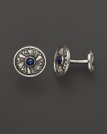 Elegant, intricately textured sterling silver cufflinks, set with sapphires, from Buccellati.