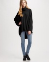 Dramatically oversized sweater of pure wool has a slouchy turtleneck, long dolman sleeves and a hi-lo hem. TurtleneckDropped shouldersLong dolman sleevesHi-lo hemBody: WoolDry cleanImportedModel shown is 5'10 (177cm) wearing US size Small.