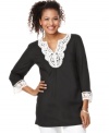 A tunic silhouette gets embellished with crochet lace trim for a handcrafted look, from JM Collection.