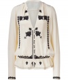 Exquisitely embellished with beaded black patterning, Day Birger et Mikkelsens cream blouse is a standout separate perfect for giving your work look a lift - V-neckline, long sleeves, buttoned front, elasticized waist with softly ruffled hemline - Feminine tailored fit - Team with everything from jeans and flats to pencil skirts and heels