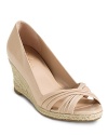 Step into spring with an elegant open toe jute wedge. From Cole haan.