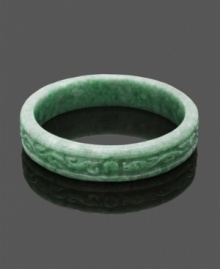 For a look as unique as you. This carefully-crafted and carved bangle features an intricate scrolling pattern made entirely of beautiful green jade. Bangle slips over the wrist. Approximate diameter: 3 inches.