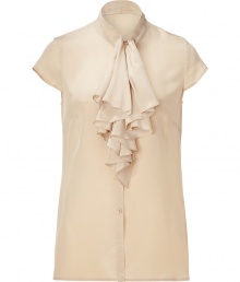 Elegant top in fine, almond silk - Button down style, with small, stand-up collar and short sleeves - The standout detail: chic ruffle flounce at chest - Slim cut close to the body, hits just below hip - Light darting at back and sides creates a streamlined silhouette - Go for a classic look with a pencil skirt and pumps, or pair with leather pants and ankle booties for an edgier appeal