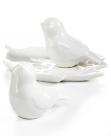 Sweet but sleek. Bird salt and pepper shakers are natural companions to the modern table setting, perched on a leaf-shaped tray in glazed white porcelain from Martha Stewart Collection.