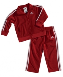 Start baby off on a stylish track with this sporty Adias jacket and pants set.