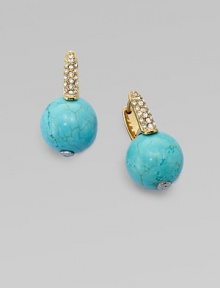 Smooth balls of bold turquoise accented with rhinestone encrusted hinged posts. TurquoiseGlass stonesGoldtone steelLength, about ¾Hinge-and-post backImported 