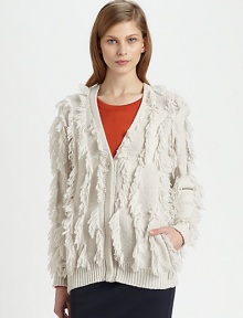 Allover fringe adds an unexpected touch to this lengthy, wool-rich topper with slash pockets and ribbed trim. V-neckButton frontLong sleevesSlash pocketsRibbed cuffs and hemLonger length hits below the hips55% wool/45% polyamideDry cleanImported of Italian fabricModel shown is 5'10 (177cm) wearing US size Small.