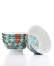 Full of life, the Lotus Inside-Out bowls couple traditional florals on a band of vibrant teal with more stylized blooms, all in everyday porcelain.