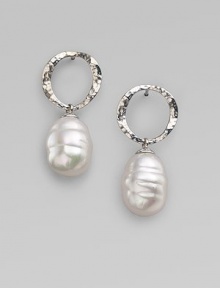 Distinctive white baroque pearls dangle delightfully from hammered sterling silver hoops. 12mm white baroque organic man-made pearls Sterling silver Hoop diameter, about ½ Post back Made in Spain