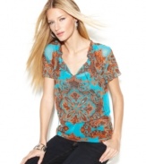 The cool combination of sheer fabric and a bold-hued print makes for a hot look, from INC.