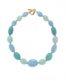 With its beautiful blue/green color scheme, Lauren by Ralph Lauren's reconstituted turquoise necklace is a tempting choice. Crafted with oval-shaped beads in gold tone mixed metal with a toggle closure. Approximate length: 18 inches.