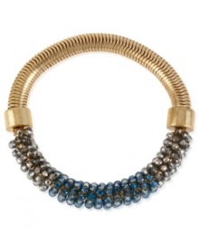 Kenneth Cole New York meets you halfway on your fashion quest with this bracelet. Crafted from gold-tone mixed metal on one side, the other side of the half-stretch bracelet is adorned with silver-colored and blue faceted beads for a colorful pop. Approximate length: 7-1/2 inches.