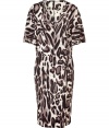 Bring fierce style to your workweek look with this animal print dress from Steffen Schraut - V-neck, short flutter sleeves, dropped waist, relaxed fit, all-over animal print - Pair with a slim trench and platform pumps