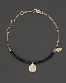 A diamond circle charm and black spinel gems great dramatic beauty on a 14K. yellow gold chain. By Meira T.