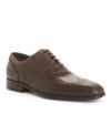 Never sacrifice comfort for style, at least not when you lace up in these smooth wingtip oxford men's dress shoes from Rockport. (Clearance)