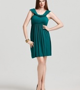 An elegantly draped neckline and flattering empire waist lend date-night status to this Rachel Pally White Label dress.