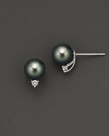 Tahitian black pearls with diamond accents. They are cultured and set in white gold.