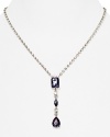 A delicate stone and crystal pendant is a glamorous focal point on this Carolee necklace, crafted of silver plated metal.