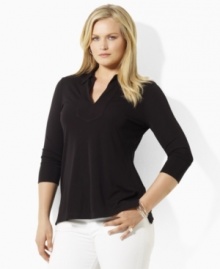 Rendered in fluid matte jersey for a flattering drape, this Lauren by Ralph Lauren tunic exudes chic minimalist style with three-quarter sleeves and a feminine V-neckline. (Clearance)