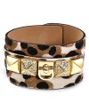 Get spotted in Juicy Couture with this cuff bracelet, crafted of textured haircalf and dressed up with bold plated metal studs and a smattering of spots.