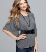 Dramatic sleeves and a soft drape contrast with a whittled waist in Cha Cha Vente's stylish top.