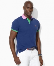 Bold color-blocking enlivens a relaxed-fitting polo crafted from lightweight cotton mesh for the perfect blend of comfort and eye-catching style.