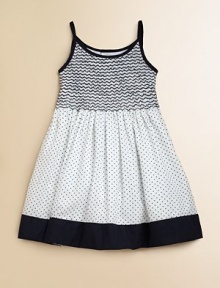 Crafted in plush cotton, this fancy frock's smocked bodice, full skirt and perky polka dots complete the look.Spaghetti strapsRound necklineButton backSmocked bodiceBack tie waistFull skirtFully linedCottonMachine wash coldImported Please note: Number of buttons may vary depending on size ordered. 