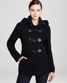 Battle the elements with this classic toggle-accented duffel coat from Barbour--a must-have for your winter wardrobe.