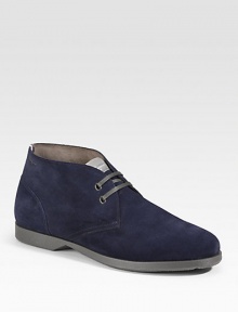 An ankle-high profile with two-eyelet construction in rich suede. Leather lining Padded insole Rubber sole Made in Italy 