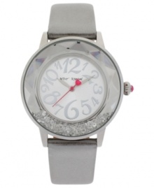 Glistening crystals swim in a faceted bezel on this elegant watch from Betsey Johnson.