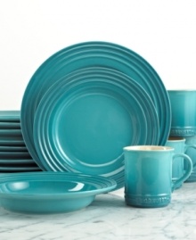 The dinnerware set that has it all. Crafted for durability and ease of use but with a brilliant enamel finish to redefine the table, Le Creuset place settings lend smart, enduring style to everyday dining. Featuring a three-ring design in soothing blue.