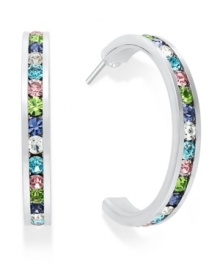 Traditions gives a sparkling boost to a simple pair of hoop earrings. A channel-set row of round-cut multicolored crystal with Swarovski elements shines within a sterling silver setting. Earrings feature a post and stud backing. Approximate diameter: 3/4 inch.