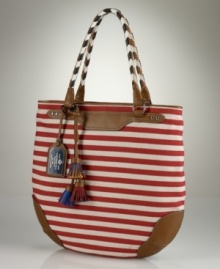 Capturing a spirited nautical vibe in durable striped cotton, the Andalusia hobo from Lauren by Ralph Lauren exhibits expert craftsmanship with whimsical multicolored leather braid accents and fringe detailing.