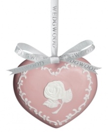 Join the fight against breast cancer with an elegant pink ornament featuring a lovely rose design on one side and a ribbon on the reverse. Keep loved ones affected by the disease in your heart throughout the season.