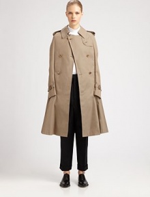 A cutting-edge riff on the classic trench defines this modern cape design.Foldover collarEpaulettesButton gunflapDouble-breasted button detailsTacked-down faux sleeves with buckle cuffsButton-down rainflapBack vent with inner tab closureFully linedAbout 36 from shoulder to hemCottonDry cleanImportedModel shown is 5'9½ (176cm) wearing US size Small. 