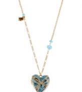 A stunning heartfelt statement. This necklace from Betsey Johnson is crafted from gold-tone mixed metal glass stones along the side on the way to a glass heart pendant with glittery accents. Approximate length: 32 inches + 3-inch extender. Approximate drop: 1-1/2 inches.