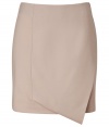 An ultra chic take on this workwear essential separate, Cacharels folded wool skirt guarantees an understated elegant polish to your look - Folded front with asymmetrical hemline, tonal grosgrain trim at side with hidden zip closure, double back vents - Softly tailored fit, mini-length - Team with everything from modern knits and ballerinas to feminine silk blouses and heels