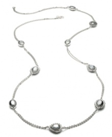 Alfani's long station necklace lengthens your elegance with glass stone accents. Crafted in hematite tone mixed metal. Approximate length: 42 inches.