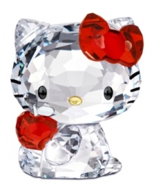 Cuter than ever, Hello Kitty clutches a shiny red apple in this irresistible Swarovski crystal figurine. With printed whiskers and her trademark red bow.