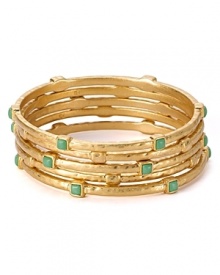 The easiest way to shine on - and the perfect accent to any look. We're wearing this set of hammered gold plated bangles from Lauren Ralph Lauren, stylishly stacked.