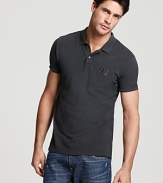 The slim fit logo polo, crafted with MARC BY MARC JACOBS' singular eye for craftmanship and on-trend style.