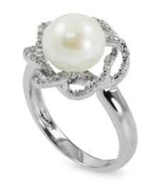 Beauty is in full bloom. This sterling silver ring features a cultured freshwater pearl (9-10 mm) surrounded by a diamond (1/10 ct. t.w.) flower for an elegant touch. Size 7.