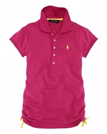 A classic short-sleeved polo shirt is updated with vibrant colors and ruching at the sides.