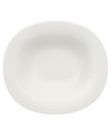 Fresh modern from Villeroy & Boch dinnerware. The dishes in this set are sheer white china in oval form that inspires simply harmonious dining. A soft fluidity and radiant glaze give this rim soup bowl quiet elegance and lasting appeal.