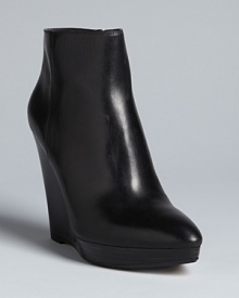 These KORS Michael Kors booties are right en point this season, with trend-right pointed toes on sleek platform wedges.