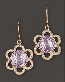 Pavé diamonds blossom around a 18K gold flowers, centered with faceted rose of France. By Carelle.